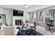 Comfortable living room with fireplace, large windows, and stylish decor offers a relaxing ambiance at 108 Fountain Oak, Villa Rica, GA 30180