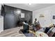 Stylish living room featuring a black accent wall, modern furniture, and a sleek, contemporary design at 108 Fountain Oak, Villa Rica, GA 30180