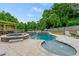 This backyard pool offers a spa and waterfall features, creating a serene and inviting outdoor oasis at 108 Fountain Oak, Villa Rica, GA 30180