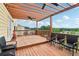 Relaxing back deck with ceiling fans and comfortable seating overlooking the backyard and neighborhood at 1564 Brunswick St, Lithia Springs, GA 30122
