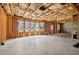 Unfinished basement space with exposed framing, four windows, and concrete floor ready to be built-out at 1564 Brunswick St, Lithia Springs, GA 30122