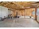 Large unfinished basement with concrete floors and framed walls, offering potential for customization at 1564 Brunswick St, Lithia Springs, GA 30122