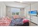 Comfortable bedroom with cozy decor and ample natural light at 1564 Brunswick St, Lithia Springs, GA 30122