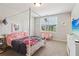 Comfortable bedroom with cozy decor and ample natural light at 1564 Brunswick St, Lithia Springs, GA 30122