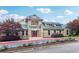 Charming clubhouse with stone accents, green metal roofs and surrounded by beautiful landscaping at 1564 Brunswick St, Lithia Springs, GA 30122