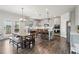 Bright eat-in kitchen with gray cabinets, island, stainless appliances, and access to deck at 1564 Brunswick St, Lithia Springs, GA 30122