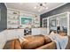 Comfortable living room featuring custom built-in shelving, stylish decor, and elegant details at 1564 Brunswick St, Lithia Springs, GA 30122