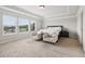 Bright main bedroom with sitting area and tray ceiling, offering a relaxing retreat at 1564 Brunswick St, Lithia Springs, GA 30122