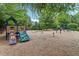 Community playground with play structures, swings, and a soft landing surface for safe play at 1564 Brunswick St, Lithia Springs, GA 30122