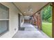 A spacious back patio featuring stairs to the backyard and dual ceiling fans at 1840 Tululah Trl, Smyrna, GA 30082