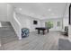 Finished basement featuring a pool table, hardwood floors, gray walls, and natural light from a window at 1840 Tululah Trl, Smyrna, GA 30082