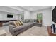 Spacious basement living area with a comfortable sectional sofa and a media center at 1840 Tululah Trl, Smyrna, GA 30082
