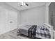 Cozy bedroom featuring a twin bed, hardwood style floors, and neutral colored walls at 1840 Tululah Trl, Smyrna, GA 30082