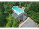 Overhead view of a community pool and parking near treed amenity center at 1840 Tululah Trl, Smyrna, GA 30082