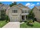 Charming two-story home featuring a well-manicured lawn and a welcoming front porch at 1840 Tululah Trl, Smyrna, GA 30082