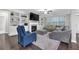 Bright living room with built-in shelving, fireplace, and dark hardwood floors at 1840 Tululah Trl, Smyrna, GA 30082
