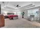 Spacious primary bedroom featuring tray ceilings, carpet floors, and natural light at 1840 Tululah Trl, Smyrna, GA 30082
