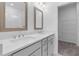 Modern bathroom with double sinks, walk-in shower, and a view of the walk-in closet at 344 Olmstead Way # 32, Alpharetta, GA 30022