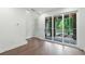 Hardwood floor bedroom with sliding glass doors leading to an outdoor patio, natural light and closet at 344 Olmstead Way # 32, Alpharetta, GA 30022