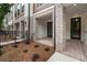 Welcoming front porch featuring brick pavers, a fenced-in yard, and stylish exterior details at 344 Olmstead Way # 32, Alpharetta, GA 30022