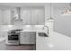 Kitchen featuring modern appliances, white countertops, and stainless steel sink at 344 Olmstead Way # 32, Alpharetta, GA 30022
