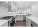 Modern kitchen featuring stainless steel appliances, white cabinets, and quartz countertops at 344 Olmstead Way # 32, Alpharetta, GA 30022