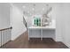 Open-concept kitchen with quartz countertops, stainless steel appliances, and modern pendant lighting at 344 Olmstead Way # 32, Alpharetta, GA 30022