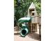 Fun outdoor playground featuring a green slide and wooden play structure for to enjoy at 344 Olmstead Way # 32, Alpharetta, GA 30022