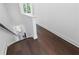 A view of the dark hardwood stairway with white walls and trim, leading to the next floor at 344 Olmstead Way # 32, Alpharetta, GA 30022