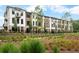 Beautifully designed townhomes featuring modern architecture, lush landscaping, and private balconies at 344 Olmstead Way # 32, Alpharetta, GA 30022