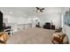 Open bonus room boasts neutral carpet, multiple windows, and a ceiling fan, making it ideal for leisure and entertainment at 4425 Martel Dr, Cumming, GA 30040