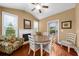 Cozy breakfast nook features a fireplace, vaulted ceilings, and natural light streaming through the windows at 4425 Martel Dr, Cumming, GA 30040
