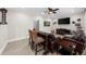 A well-designed game room featuring a large TV, comfy leather seating, and a bar-top with seating at 4425 Martel Dr, Cumming, GA 30040