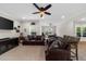 Bright game room featuring a large TV, two leather sofas, and an air hockey table at 4425 Martel Dr, Cumming, GA 30040