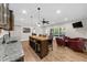 Charming game room with bar area and granite counters next to comfortable seating at 4425 Martel Dr, Cumming, GA 30040