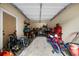 One car garage with workbench and storage shelves for tools and bikes at 4425 Martel Dr, Cumming, GA 30040