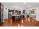 Modern kitchen with stainless steel appliances, granite countertops, and breakfast bar at 4425 Martel Dr, Cumming, GA 30040
