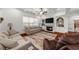 Spacious living room with coffered ceiling, fireplace, and ample seating at 4425 Martel Dr, Cumming, GA 30040