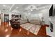 Bright living room with coffered ceilings, fireplace, and hardwood floors at 4425 Martel Dr, Cumming, GA 30040