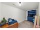 Storage room with wood flooring, blue cabinets, and a single light bulb at 4425 Martel Dr, Cumming, GA 30040