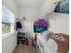 Walk-in closet offers ample storage with custom shelving and organization system and a window at 4425 Martel Dr, Cumming, GA 30040