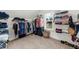 Spacious walk-in closet features custom shelving for optimal organization and storage, plus secure safe at 4425 Martel Dr, Cumming, GA 30040