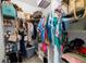 Walk-in closet with ample shelving, shoe racks, and hanging storage space for optimal organization at 4425 Martel Dr, Cumming, GA 30040