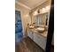 Bathroom with double vanity, vessel sinks, and tiled shower at 6340 Koweta Rd, Fairburn, GA 30213