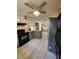 Well-appointed kitchen with tile floors, updated countertops, and modern appliances at 6340 Koweta Rd, Fairburn, GA 30213