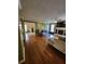 Open-concept living area featuring hardwood floors and a cozy fireplace at 6340 Koweta Rd, Fairburn, GA 30213