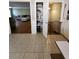 Convenient pantry adjacent to living room, with tiled floors and storage at 6340 Koweta Rd, Fairburn, GA 30213