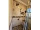 Custom tiled shower with a mosaic tile accent, glass door and seating at 6340 Koweta Rd, Fairburn, GA 30213