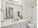 Bathroom features a large mirror, bathtub, and coordinated fixtures for a clean and classic design at 1634 Ponce De Leon Ne Ave # 514, Atlanta, GA 30307