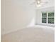 Bright, neutral bedroom with large windows offering natural light and a peaceful view to create a relaxing atmosphere at 1634 Ponce De Leon Ne Ave # 514, Atlanta, GA 30307